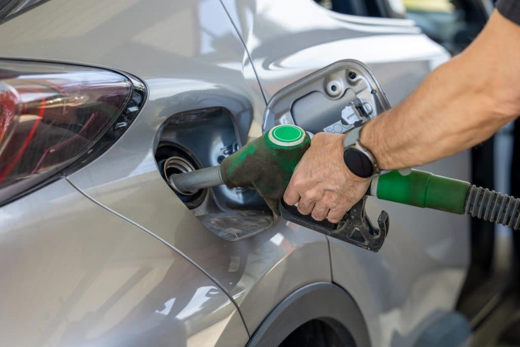 Driver refuelling a car at a UAE petrol station